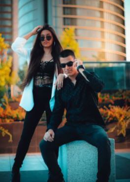 Marta Diaz and her brother posing in their own styles.